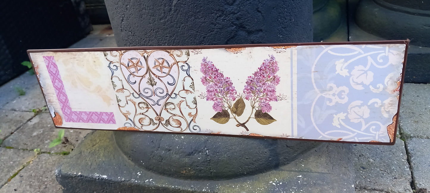 Skilt, metal, med blomsterbort