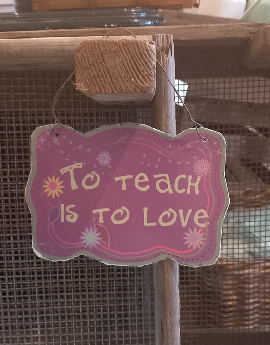 Skilt, metal, To teach is to love